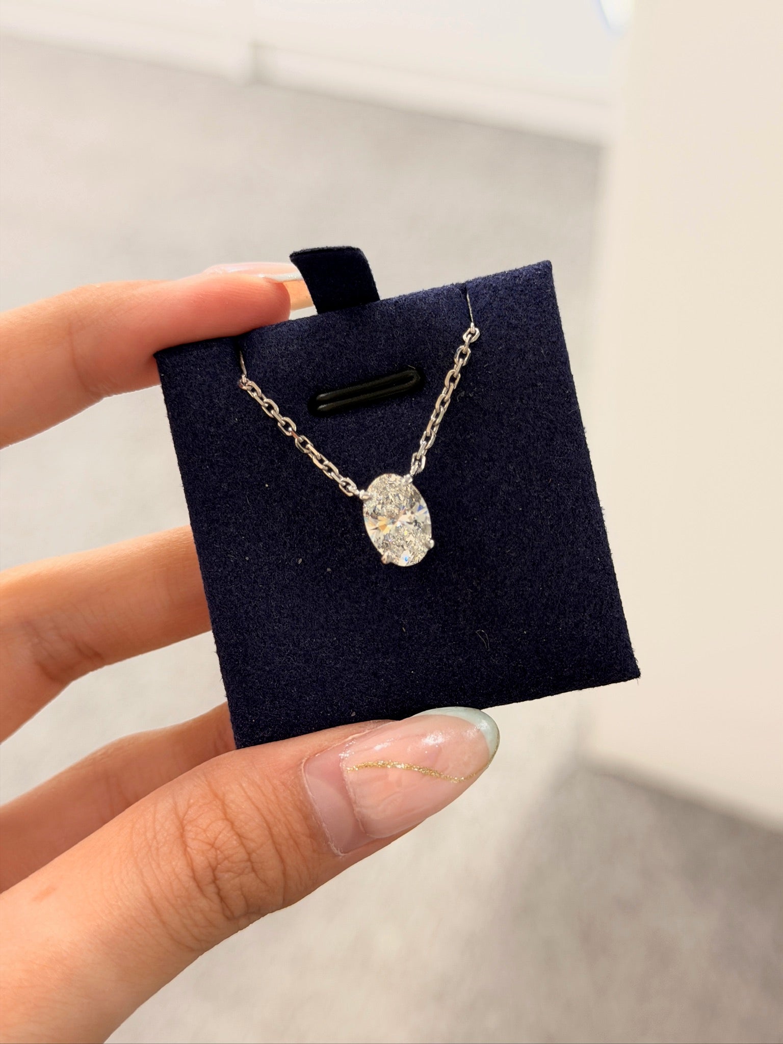 Oval Solitaire Pendant 2CT in hand